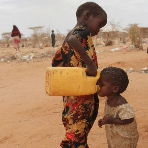 Community gathered around a water source